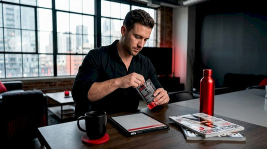 Man using discreet energy supplement at kitchen table