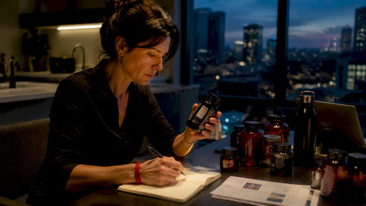 Woman comparing non-addictive energy supplements at home